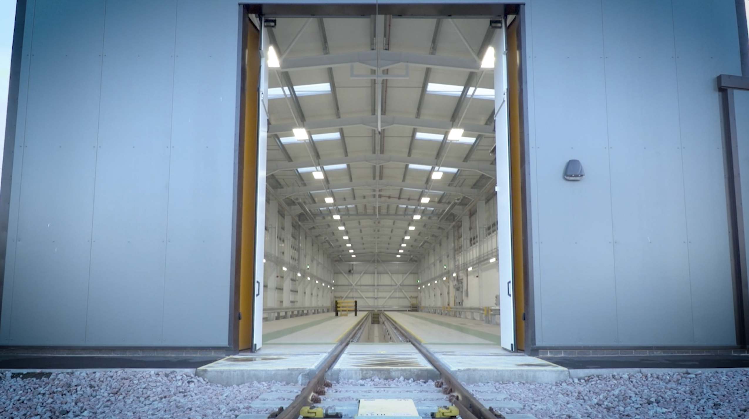 Train shed with automatic bi-fold doors